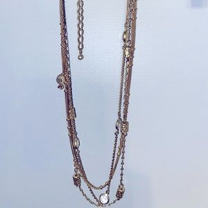 3 stacking gold necklaces.